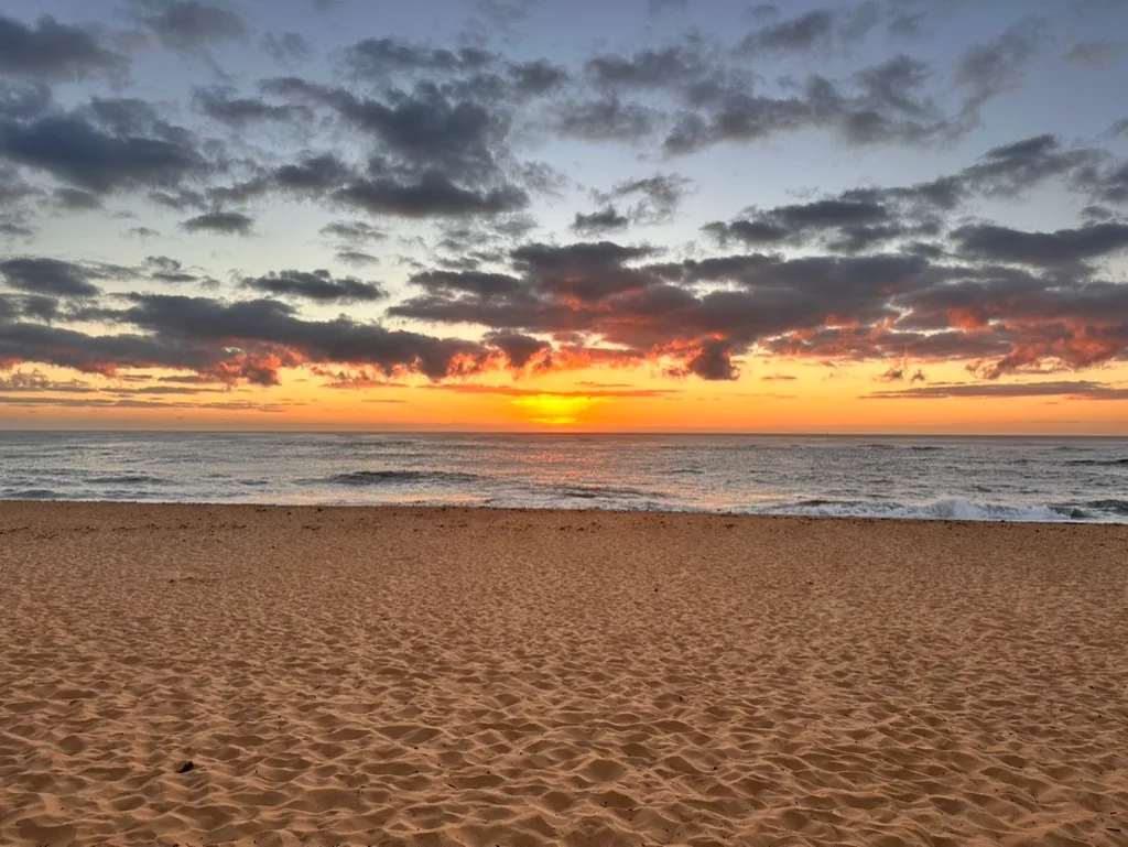 Sunrise Over the Surf